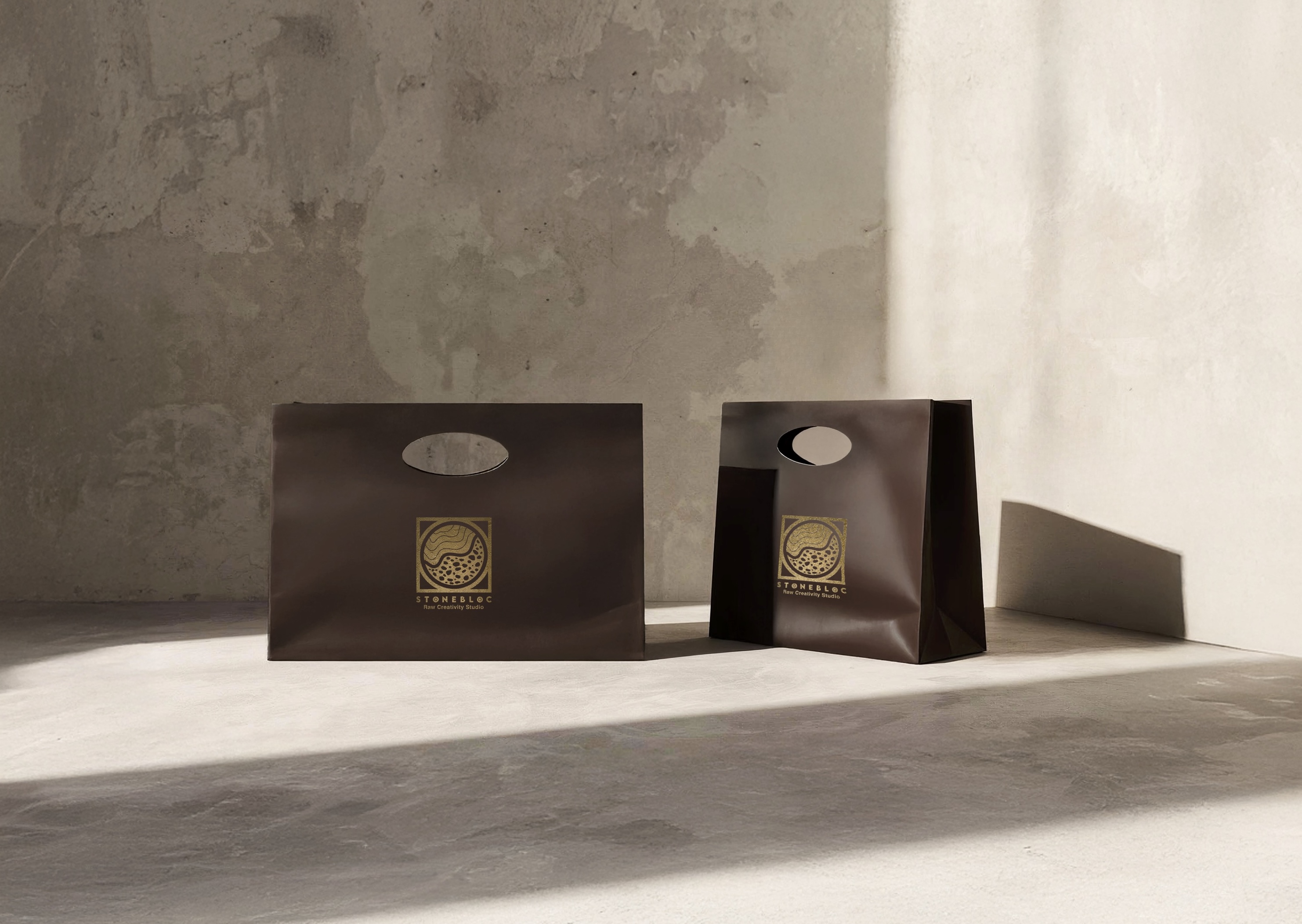 Dark brown leather shopper bag with golden Stonebloc logo