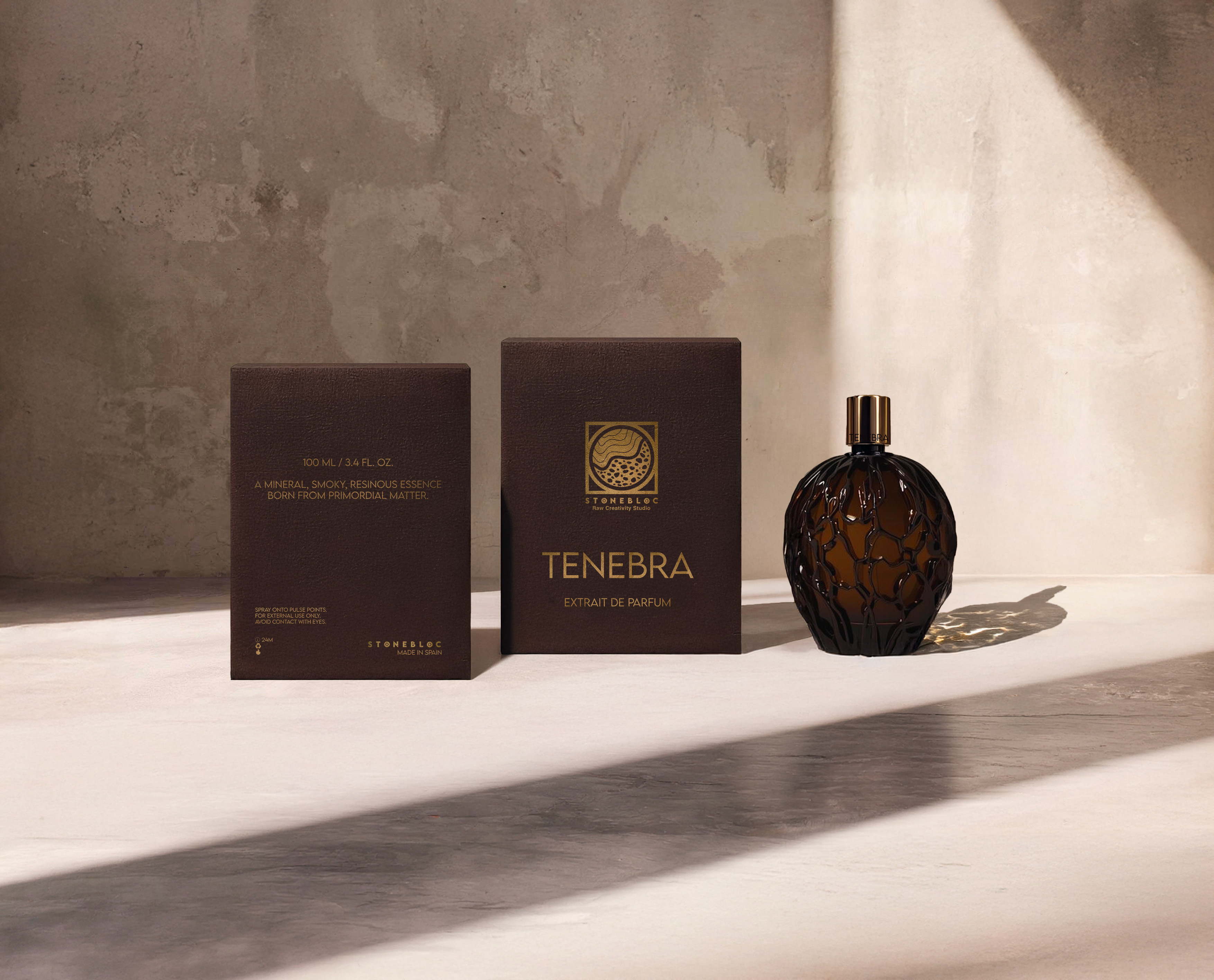 Dark and elegant cardboard packaging of the Tenebra perfume by Stonebloc with crafted glass bottle